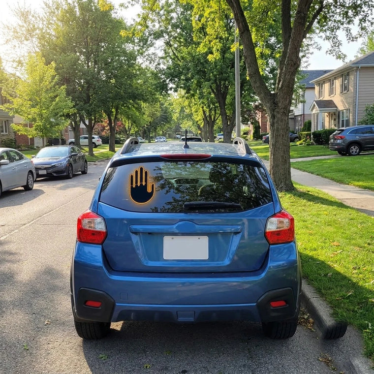 Driver smiling in traffic with the gesture light glowing behind