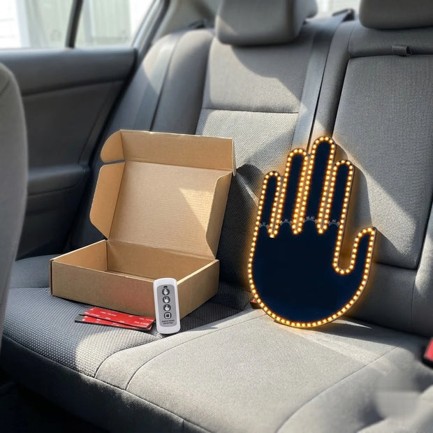 The gesture light kit unboxed on a car seat, ready to mount
