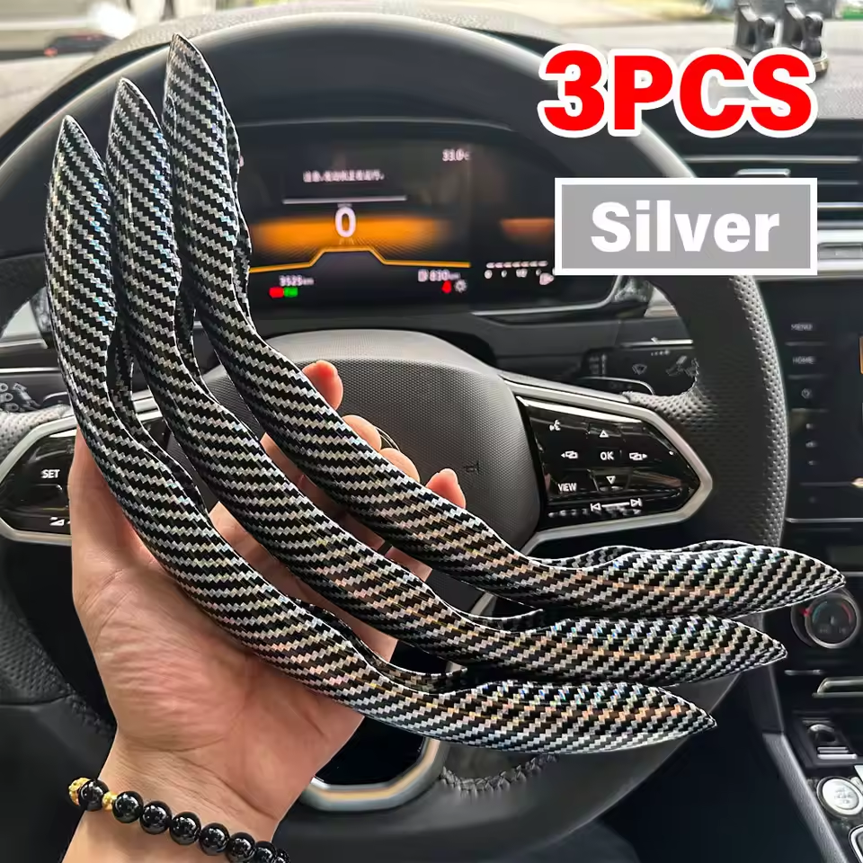 Carbon fiber steering wheel cover held in front of a car dashboard with '3PCS Silver' text.