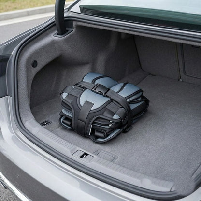 Folded portable travel car seat in a car trunk