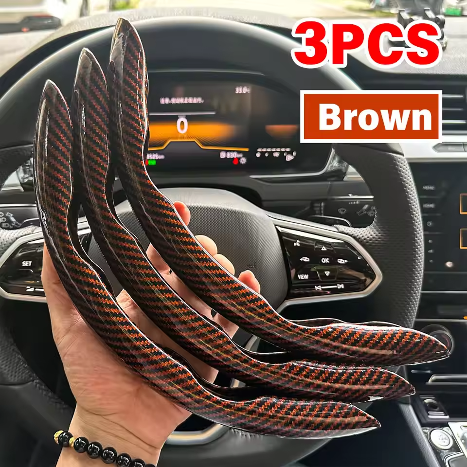 Three brown carbon fiber strips held in front of a car's dashboard.