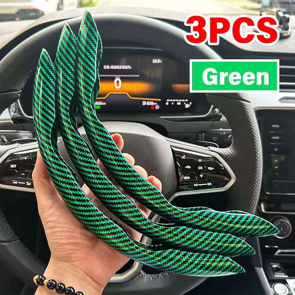 Three green carbon fiber strips held in front of a car dashboard.