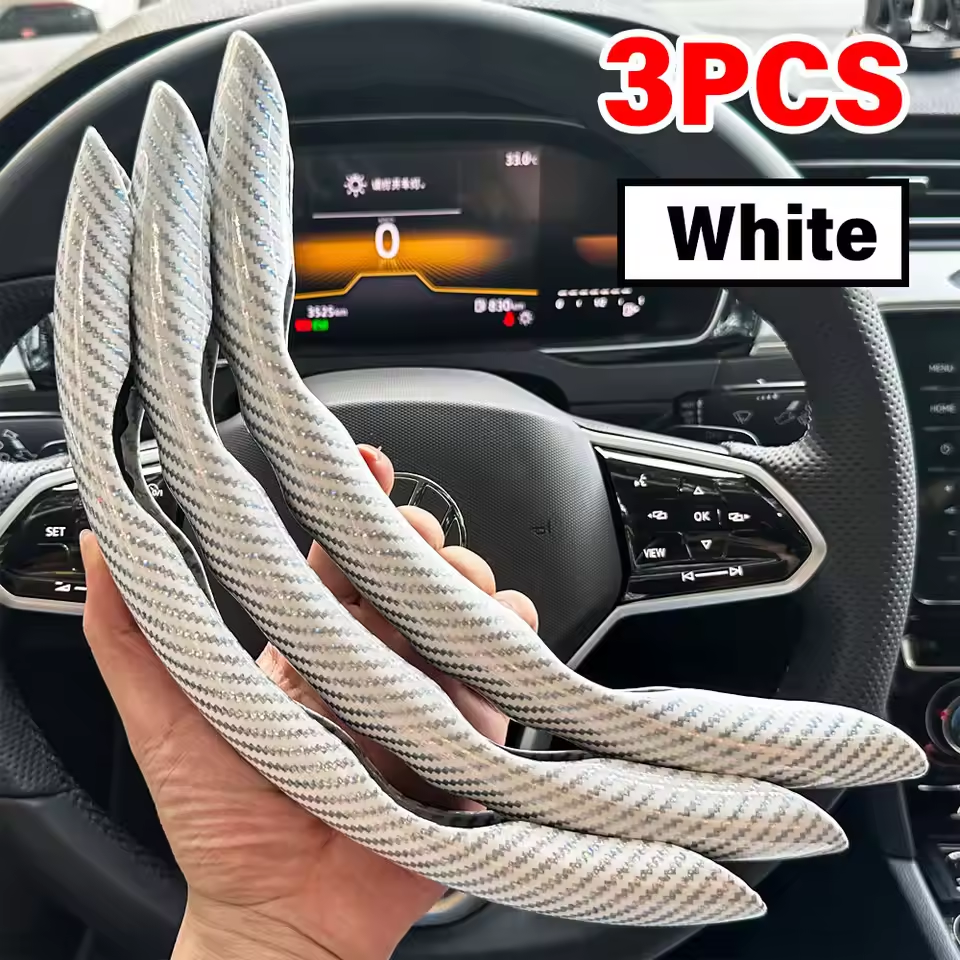 Three white car interior trim pieces held in front of a car dashboard.