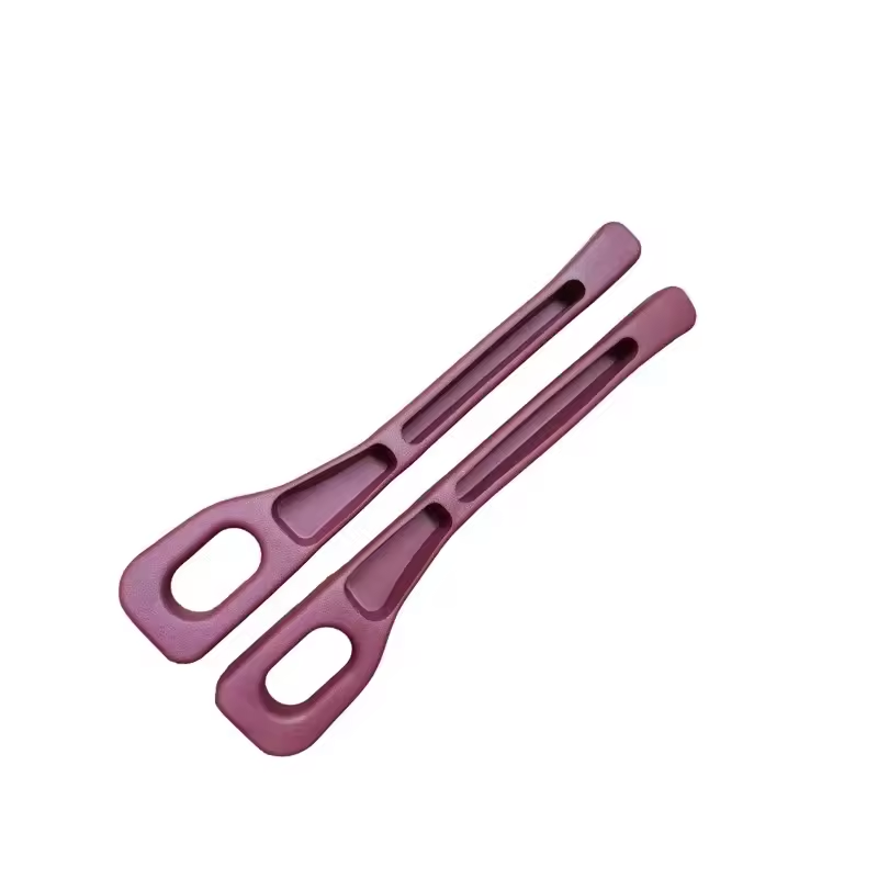 Two pink silicone tongs on a white background