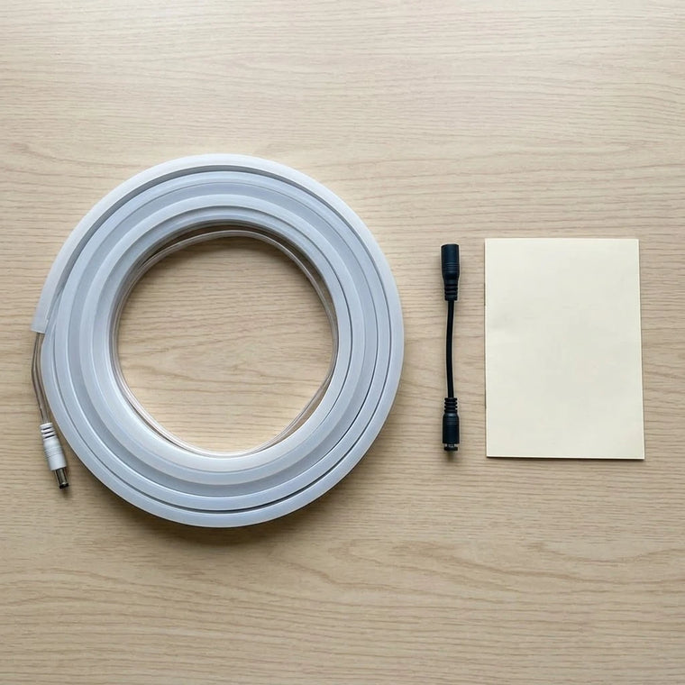 A BOLTHUT LED trunk strip coiled with its connector and install guide