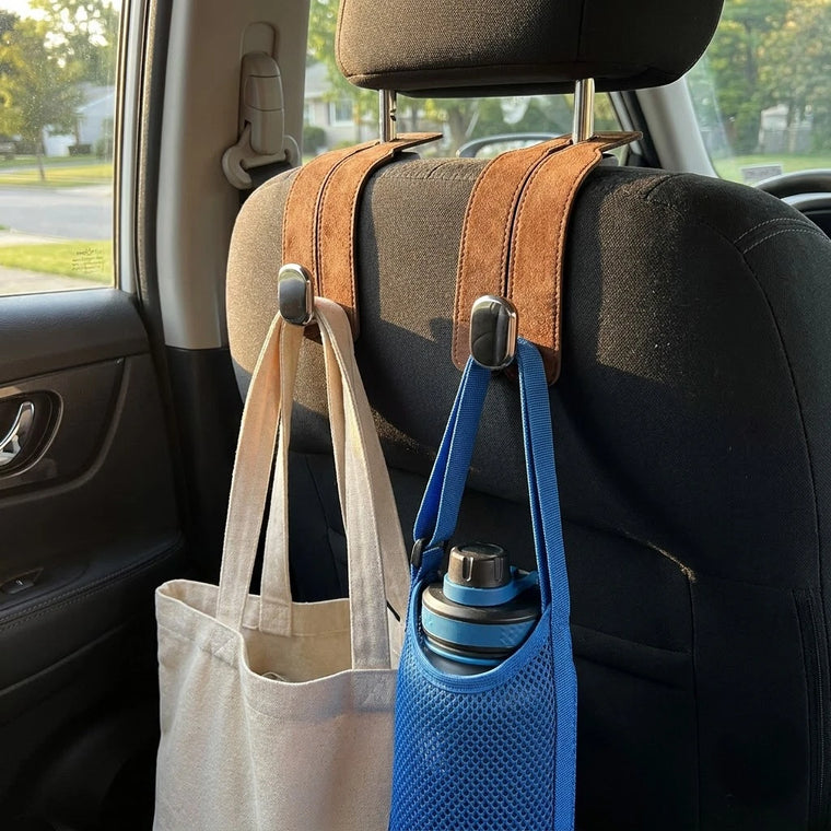 BOLTHUT leather headrest hooks holding bags in a tidy back seat