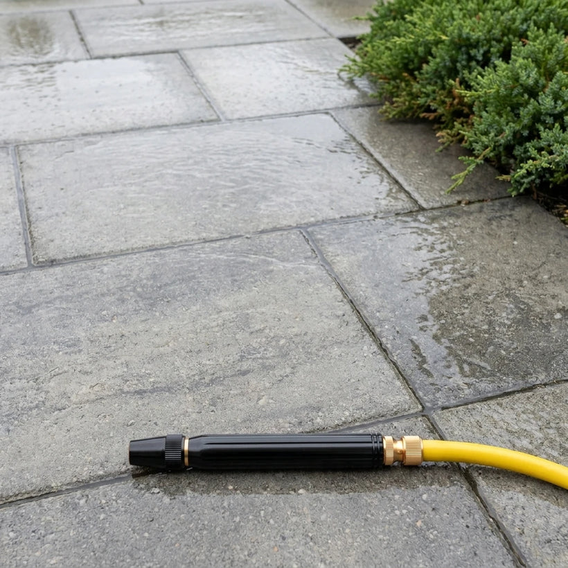 Same pavers rinsed clean with the high pressure hose nozzle