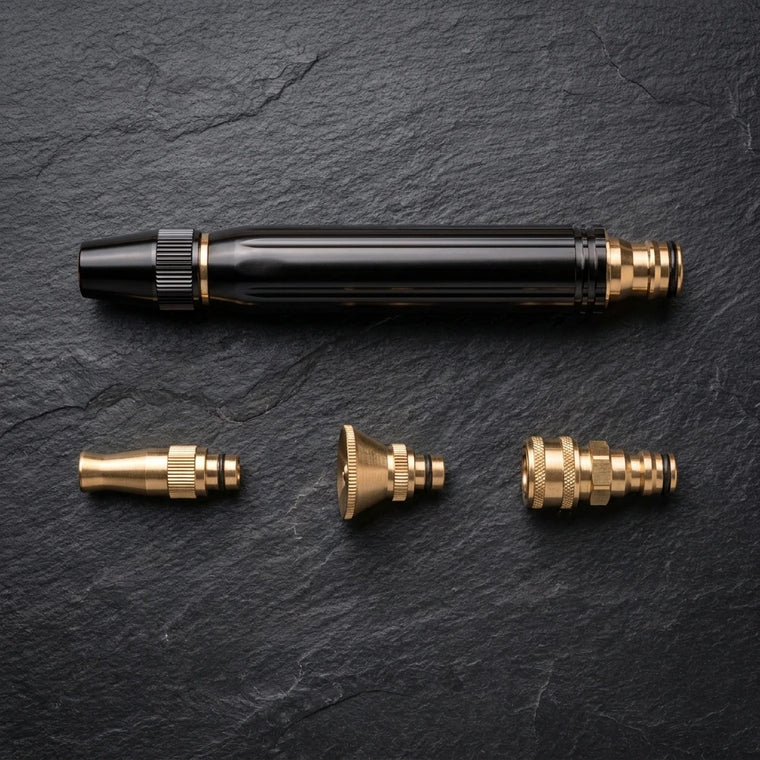 Jet wand laid out with both spray tips and the brass quick-connect fitting